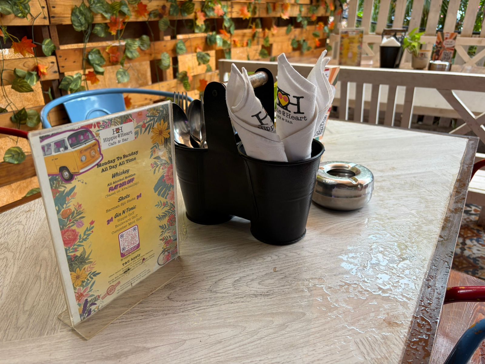 Hippie @ Heart outdoor patio table with napkin caddy and menu card
