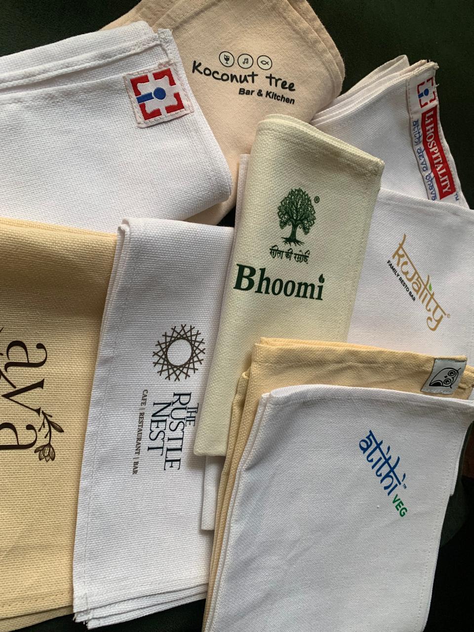 Assorted custom-printed restaurant cloth napkins
