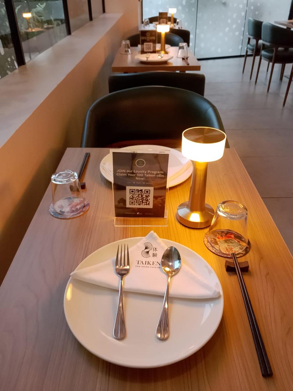 Taiken Pan Asian fine dining table with branded napkin