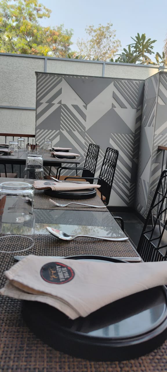 Outdoor terrace dining with branded napkins
