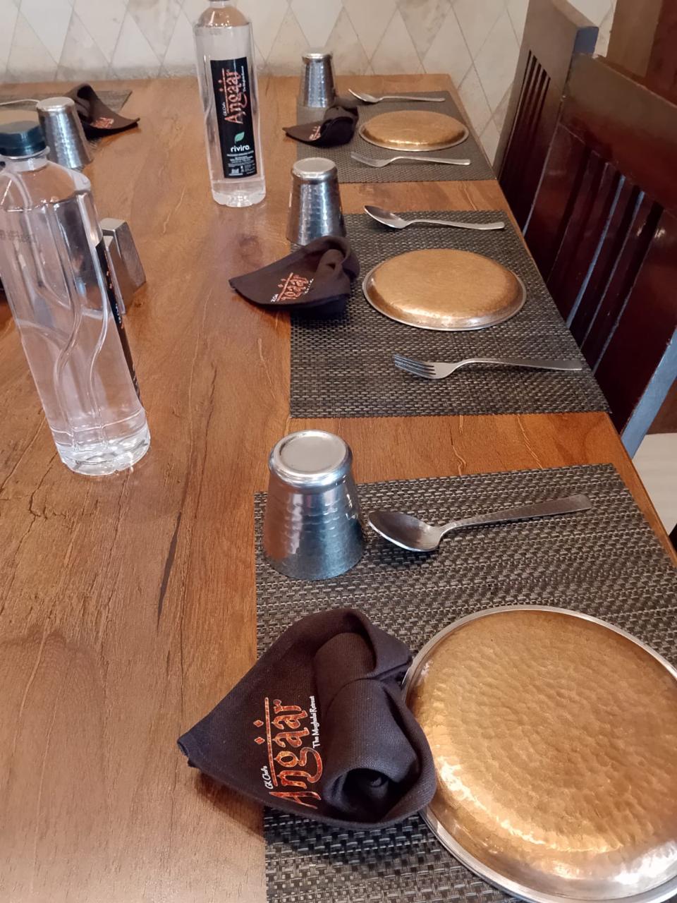 Custom branded Angaar napkins on table