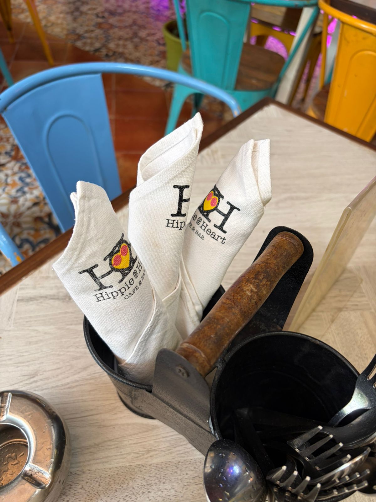 Trio of Hippie @ Heart branded napkin folds in caddy