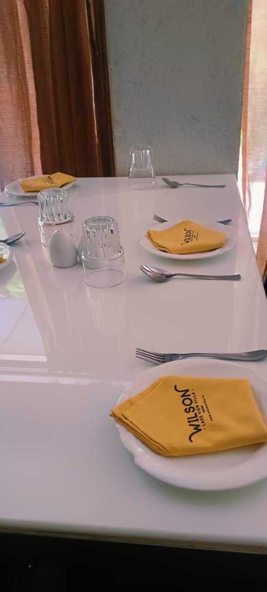 Wilson Lake View Villa table setup with yellow napkins